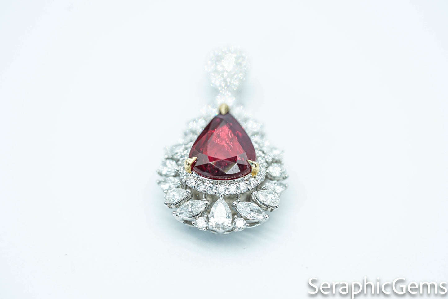 "Timeless Elegance: Pear-Shaped Pigeon Blood Ruby Ring in 18K Gold"