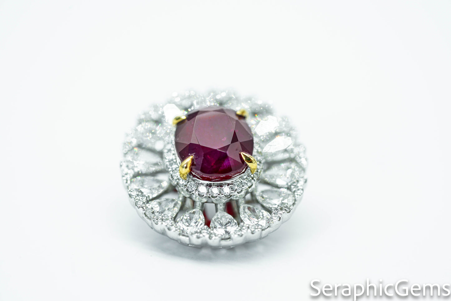 "Regal Radiance: Oval-Cut Ruby and Diamond Halo Ring"
