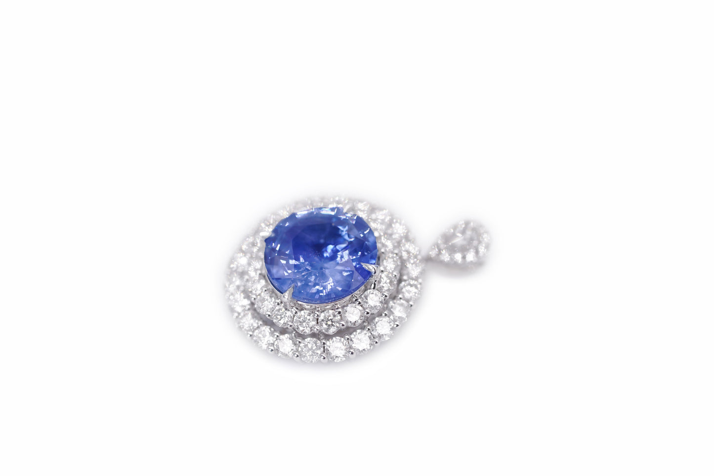 "Enchanted Elegance: Round-Cut Sapphire and Diamond Halo Ring"