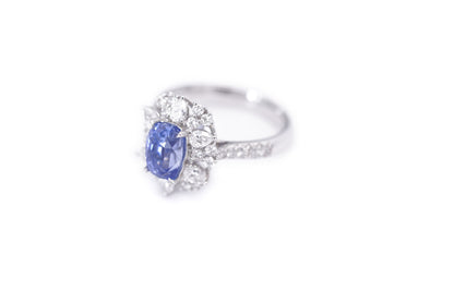 "Radiant Majesty: 3.01ct Sapphire and Diamond Halo Ring"