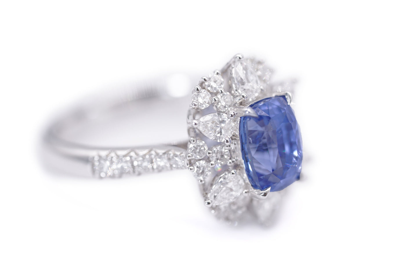 "Radiant Majesty: 3.01ct Sapphire and Diamond Halo Ring"