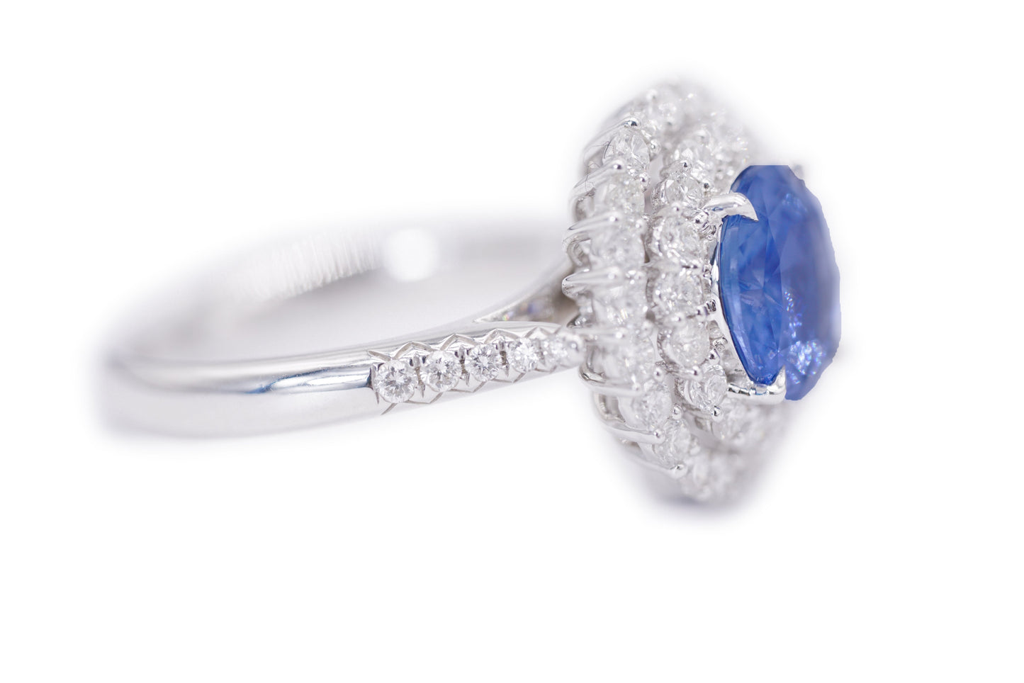 "Enchanted Elegance: Round-Cut Sapphire and Diamond Halo Ring"
