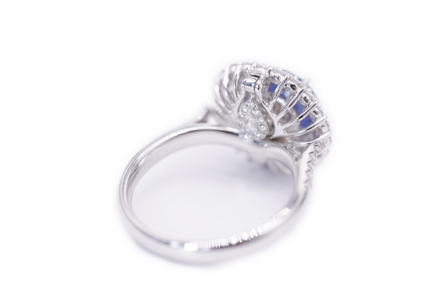 "Enchanted Elegance: Round-Cut Sapphire and Diamond Halo Ring"