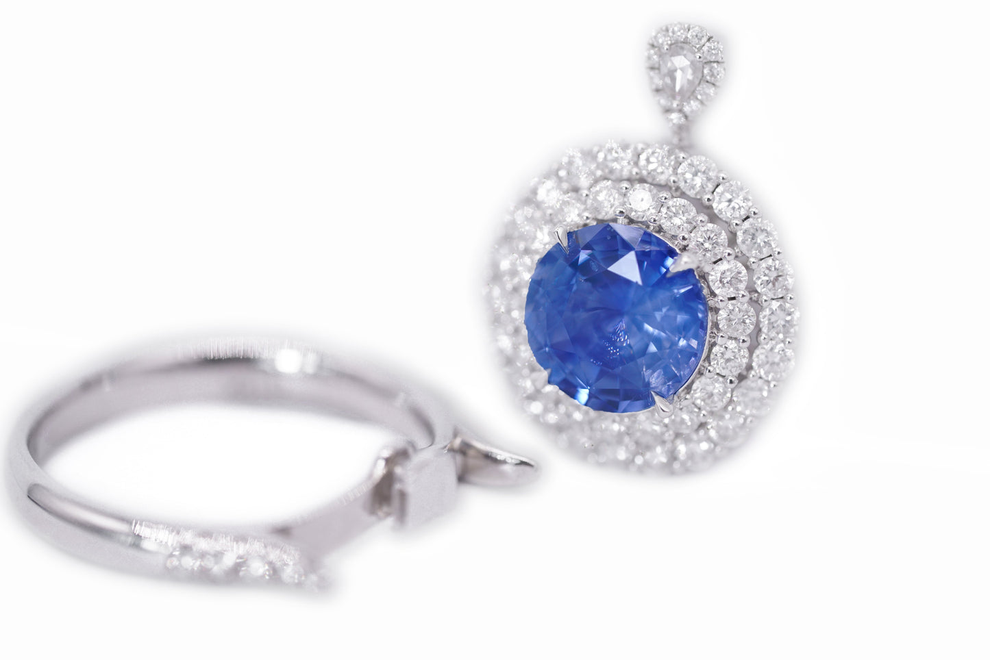 "Enchanted Elegance: Round-Cut Sapphire and Diamond Halo Ring"