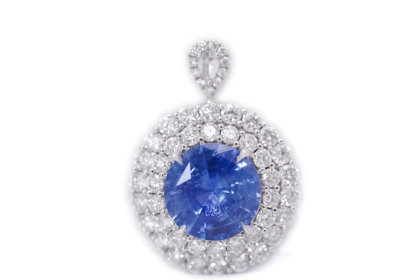"Enchanted Elegance: Round-Cut Sapphire and Diamond Halo Ring"