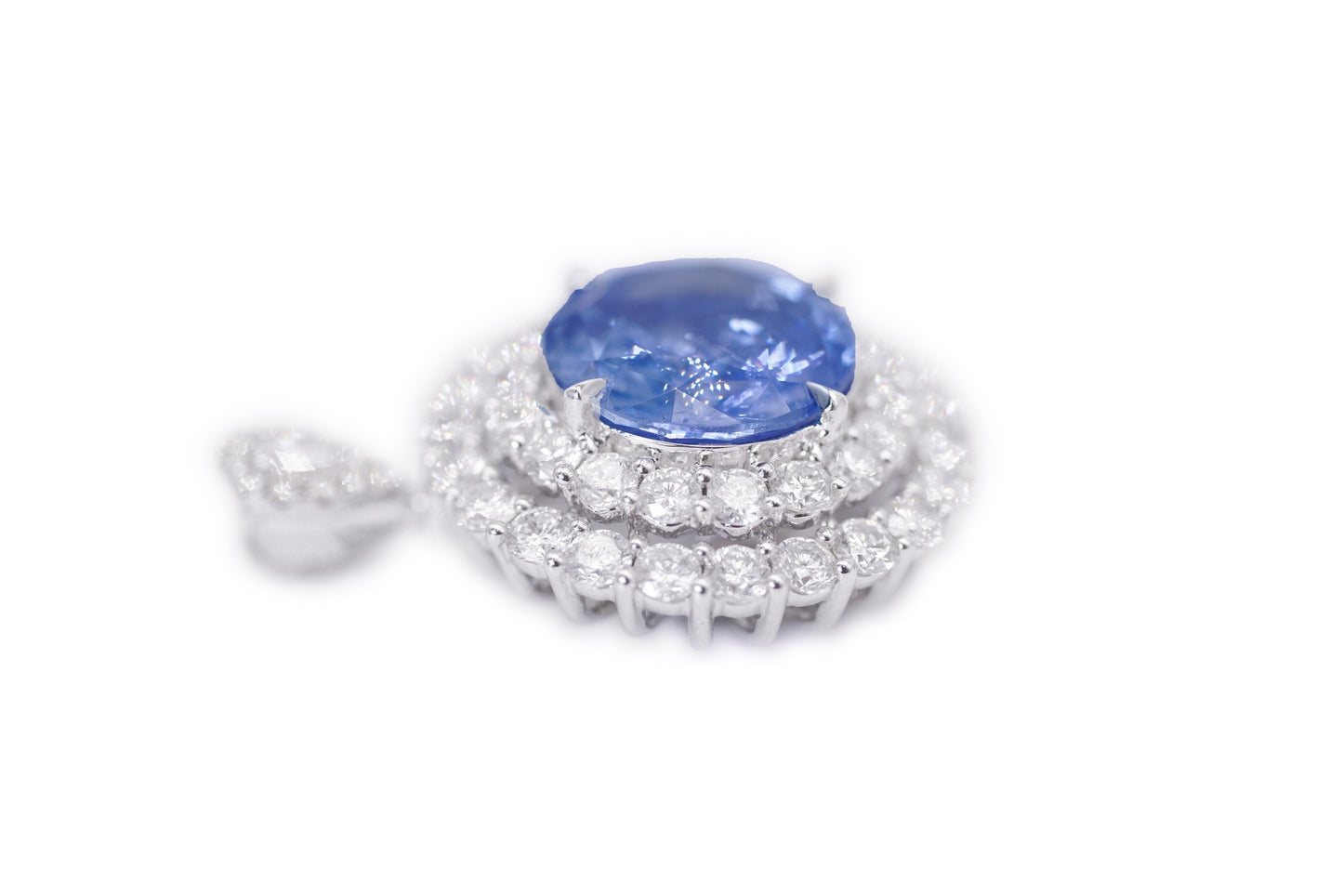 "Enchanted Elegance: Round-Cut Sapphire and Diamond Halo Ring"